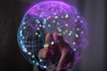 Hand interacting with a digital sphere, representing global connectivity and network technology.