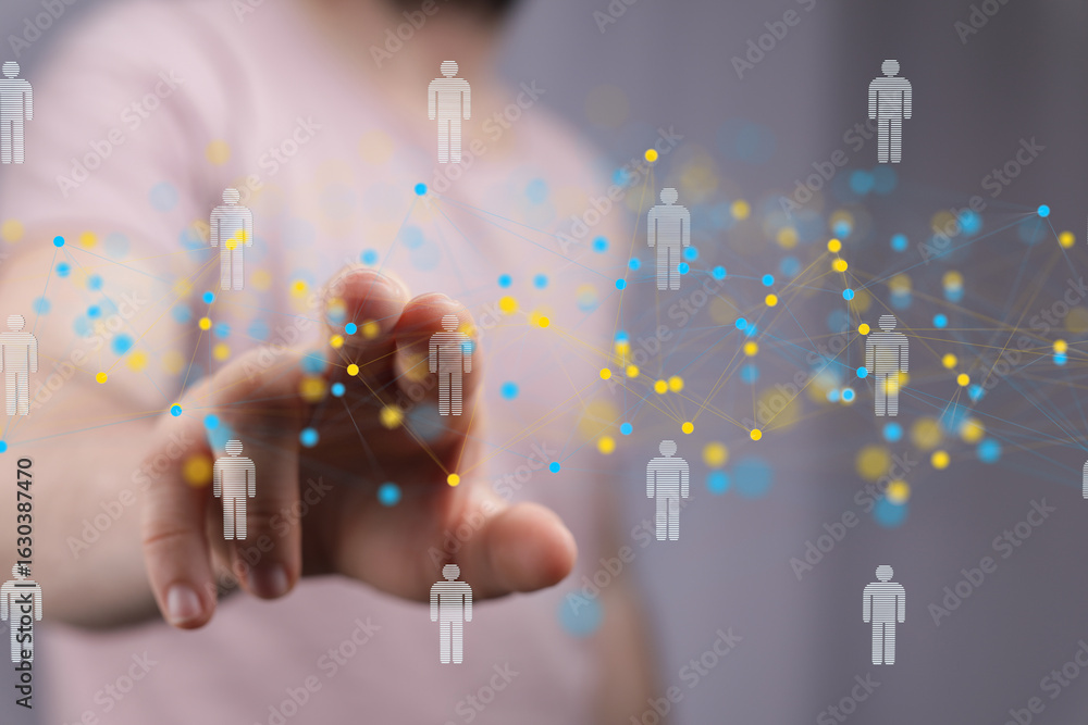 Poster hand interacting with a digital network of people, representing global communication and connection.