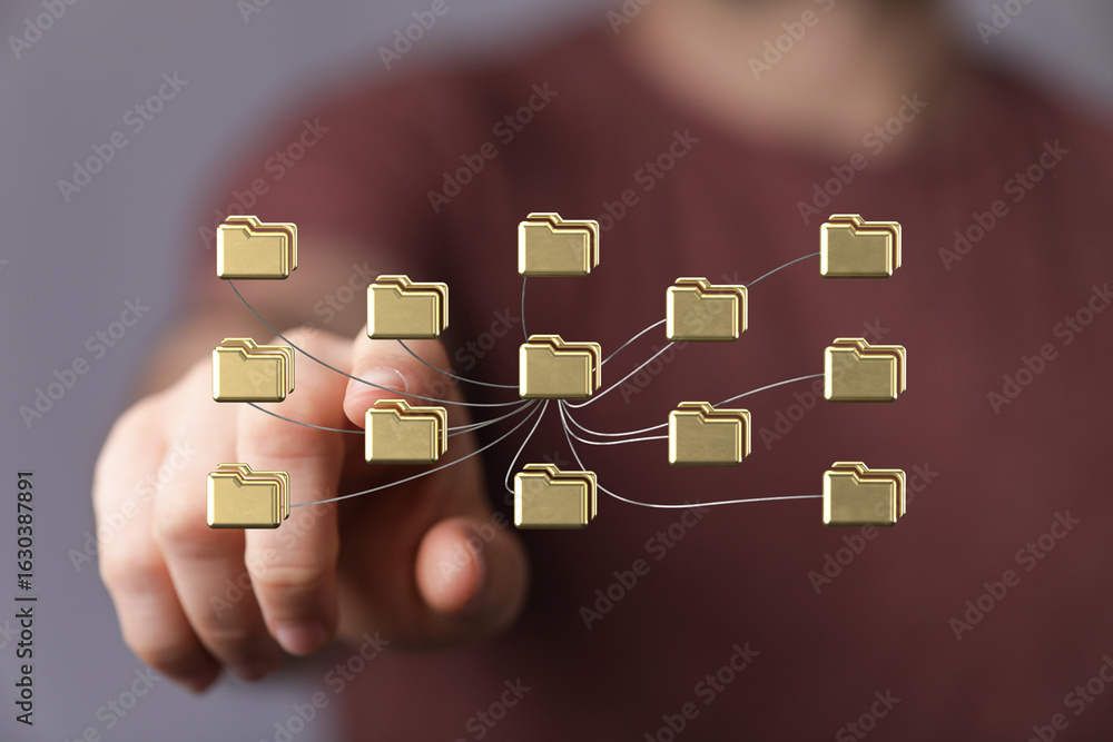 Poster hand interacts with a digital network of files. concept for data management, cloud storage, and netw