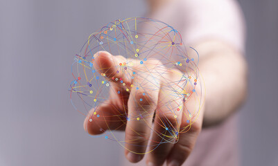 Abstract image depicting a hand interacting with a complex network. Ideal for technology,...