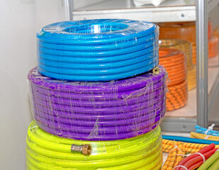 Colorful plastic hoses outside in market outdoors