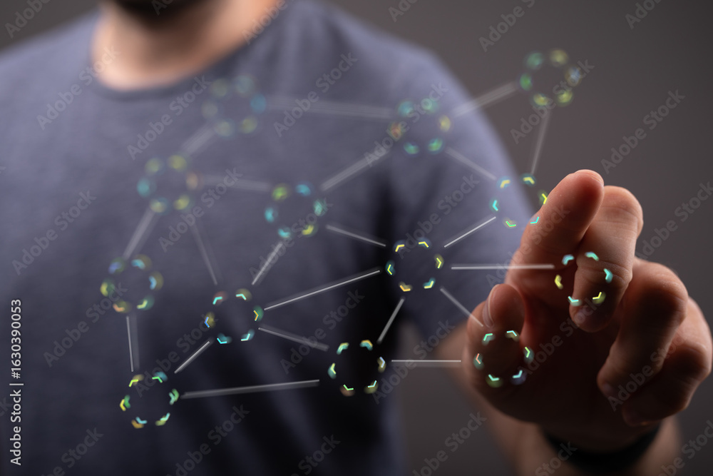 Poster a person's hand interacts with a digital network, showcasing connections and data flow.