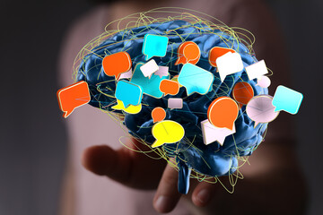 Abstract image of a brain with colorful speech bubbles, symbolizing communication and ideas.