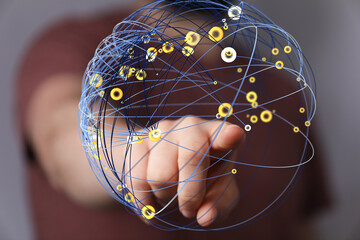 Abstract image of a hand interacting with a digital global network.  Perfect for technology,...
