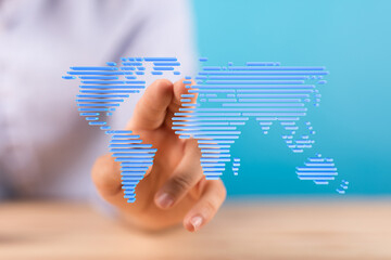 Hand interacting with a digital world map, showcasing global connectivity and technology.
