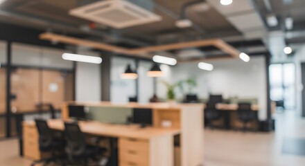 Abstract blurred background of a modern open-plan office interior. Contemporary workplace or coworking space concept.
