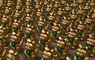 Maneki-neko cat waving his paw. Gold fortune cats wave paws illustrat. Maneki neko Japanese and Chinese figure fortune and luck cat. A lot of traditional beckoning cats figure loop, loopable animation