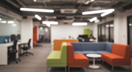 Fototapeta premium Abstract blurred view of a modern office lounge and workspace, ideal for business backgrounds.
