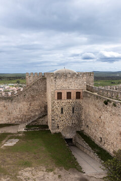 Impressive walls and tower rising above the landscape at trujillo castle