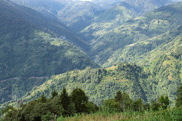 Sun rays falling on Himalayan mountain range, scenic beauty of layers of mountains, Okhrey, sikkim,...
