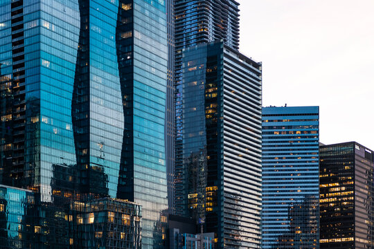 City architecture. Architecture of modern office building. Night city skyscraper. Business skyscraper building. Architectural building in business area. Glass skyscraper at night. Night cityscape - Powered by Adobe