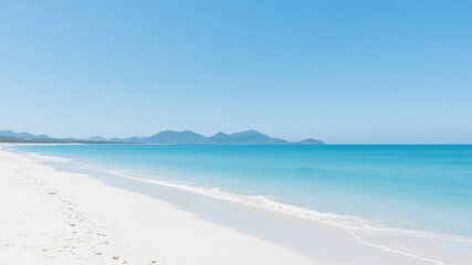Fototapeta premium Serene Beach with White Sand and Turquoise Waters Under a Clear Blue Sky