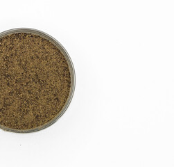 ground coffee in a glass jar