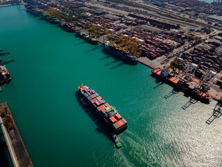 containers ship sailed into commercial port for load and unloading cargo from container ship for...