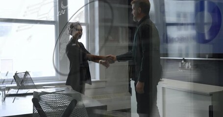 Man noticing animated business data charts and standing to greet woman colleague with handshake - Powered by Adobe