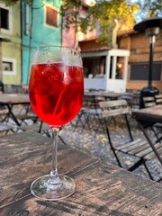 Iced Red Drink on Café Terrace Table