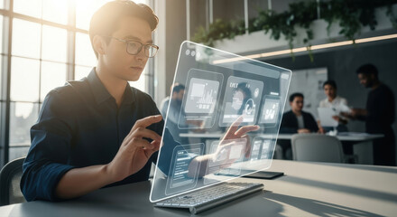 A person working with a holographic interface in a modern office setting