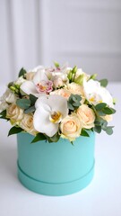Elegant floral arrangement in a light teal box