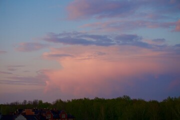 Pink clouds at sunset in summer