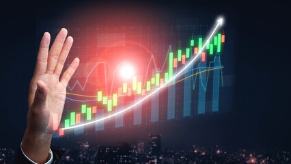 A hand is reaching toward a glowing financial graph showcasing growth over time. The scene captures a modern urban skyline at dusk, representing opportunity and success. Copula