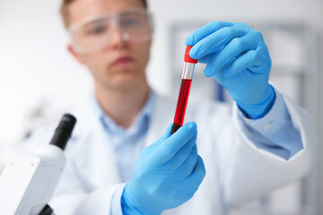 Medical analysis. Scientist working with blood sample in laboratory, selective focus
