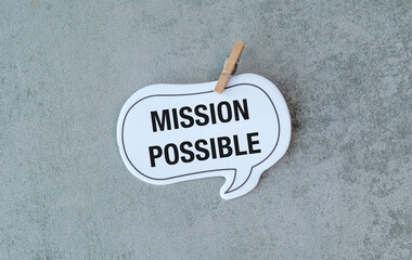 A white sign that says Mission Possible