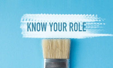 A paintbrush with the words Know Your Role written above it