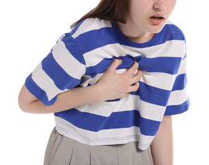 Young woman suffering from chest pain on white background, closeup
