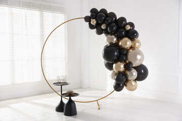 Stylish photo zone with balloons and decor in studio