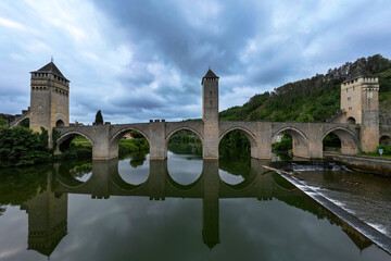 Fototapeta premium Pont Valentré, a 14th-century six-span fortified stone arch bridge crossing the river Lot in France