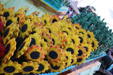 Lots of delicious sunflower shaped cookies	
