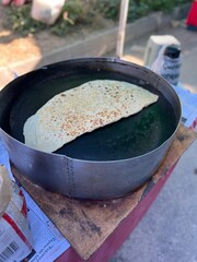 cooking meat in a pan, gözleme