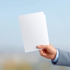 Hand Holding Blank Document with Nature Background Scene