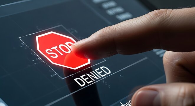 Finger Touching a "Stop Denied" Sign on a Digital Security Interface