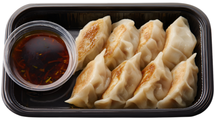 Nepalese Traditional Dish Momo. Authentic Cuisine in Nepal momo over a rustic wooden background.
Steam-cooked momos with sauce.