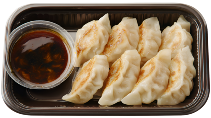Nepalese Traditional Dish Momo. Authentic Cuisine in Nepal momo over a rustic wooden background.
Steam-cooked momos with sauce.