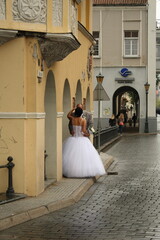 bride and groom walking in the street