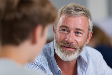 Fototapeta premium Experienced mentor guiding a young mentee through career development strategies. Coaching, wisdom.