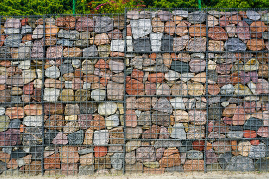 Colorful Gabion Stone Retaining Wall Close-Up with Grid Cage Mesh in Landscape Architecture Design