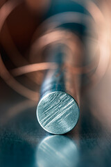Steel rod in industrial setting, close-up view of metal structure cross section