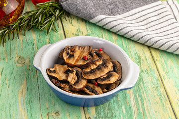 Tasty hot grilled champignon mushrooms