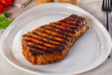 Grilled pork steak with bone