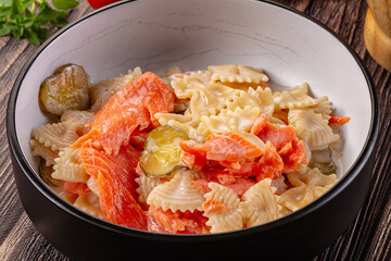 Italian pasta farfalle with salmon
