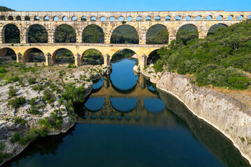 Pont du Gard, ancient Roman aqueduct bridge built in the first century AD crossing river Gardon in...