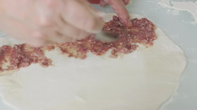Large empanada making in close-up