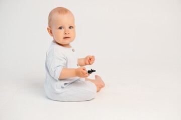 baby boy on a white isolated background, space and room for text