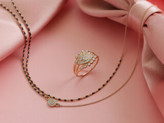 Rose gold ring and necklace with black beads and diamonds