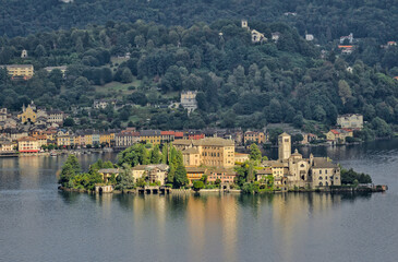 Isola San Giulio, Italy: A panoramic view of the island on Lake Orta, featuring its historic...