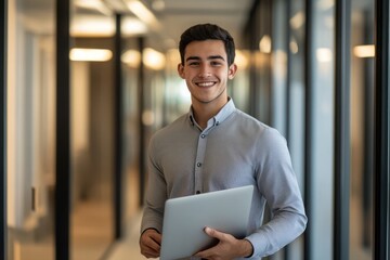Fototapeta premium Professional young man smiling with laptop