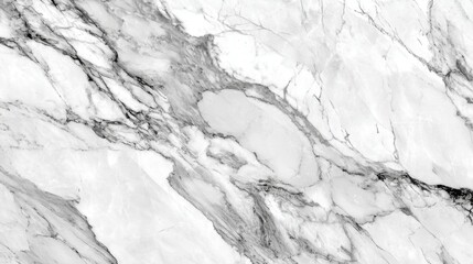 Fototapeta premium Surface showcases elegant white marble featuring stunning gray veining, perfect for upscale interiors. The polished stone reflects light, enhancing its luxurious appearance.